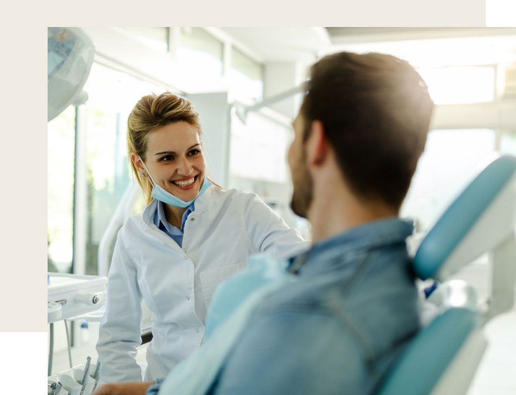 Smiling dentist with patient